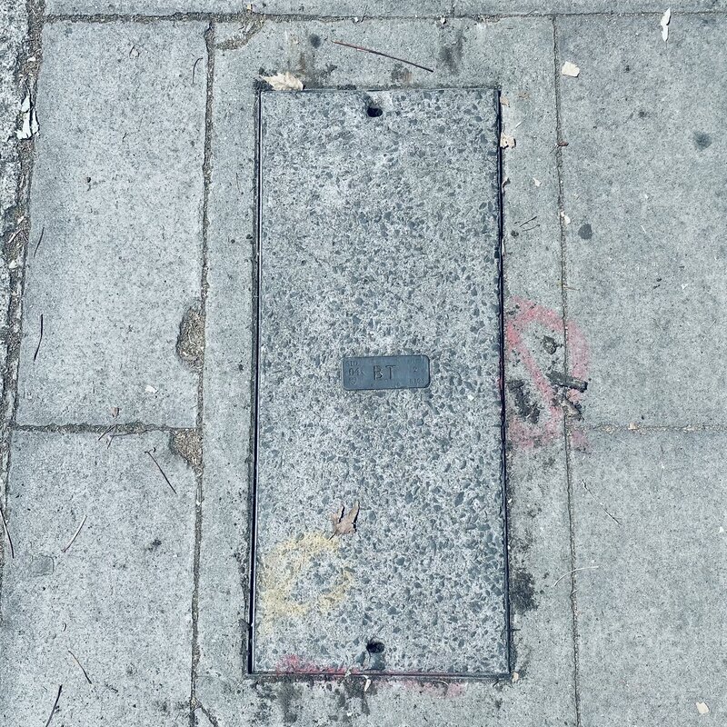 Image description: Manhole cover with a logo of BT (British Telecom)
Credit: Anne Lee Steele
