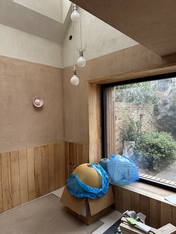 Interior view of low-carbon extension with clay finish