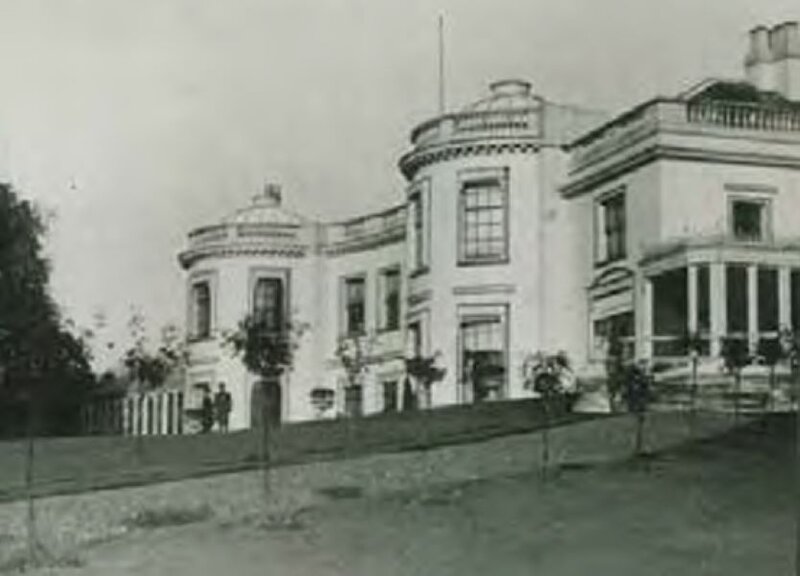 Historic photograph of Norwood Grove Mansion, early 20th century.
