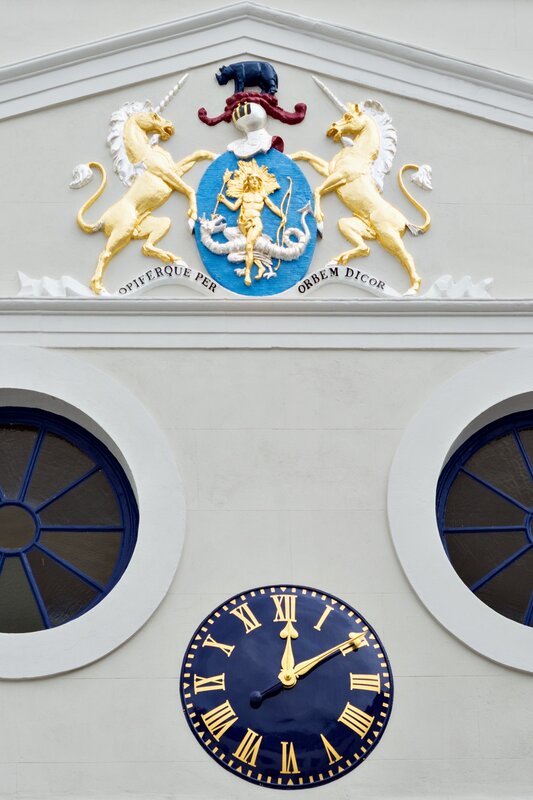 Courtyard clock and coat of arms