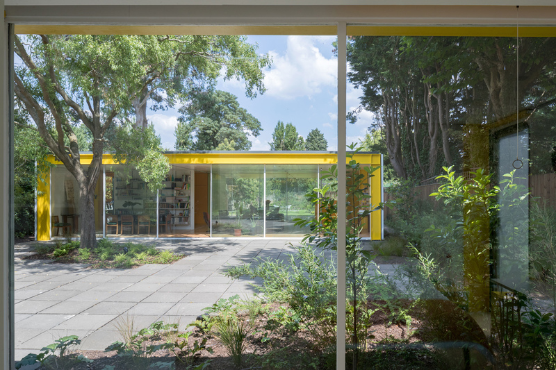 A bedroom looking to the courtyard, with House and Garden beyond